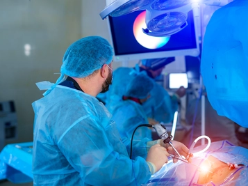 Surgeons Performing Surgery on a Patient in an Operating Room